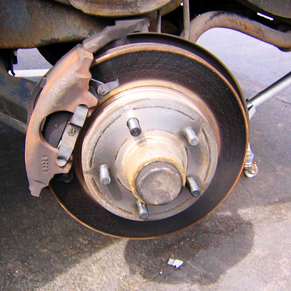 Inspecting 1996 Chevy Blazer brake rotor and caliper in brake failure investigation